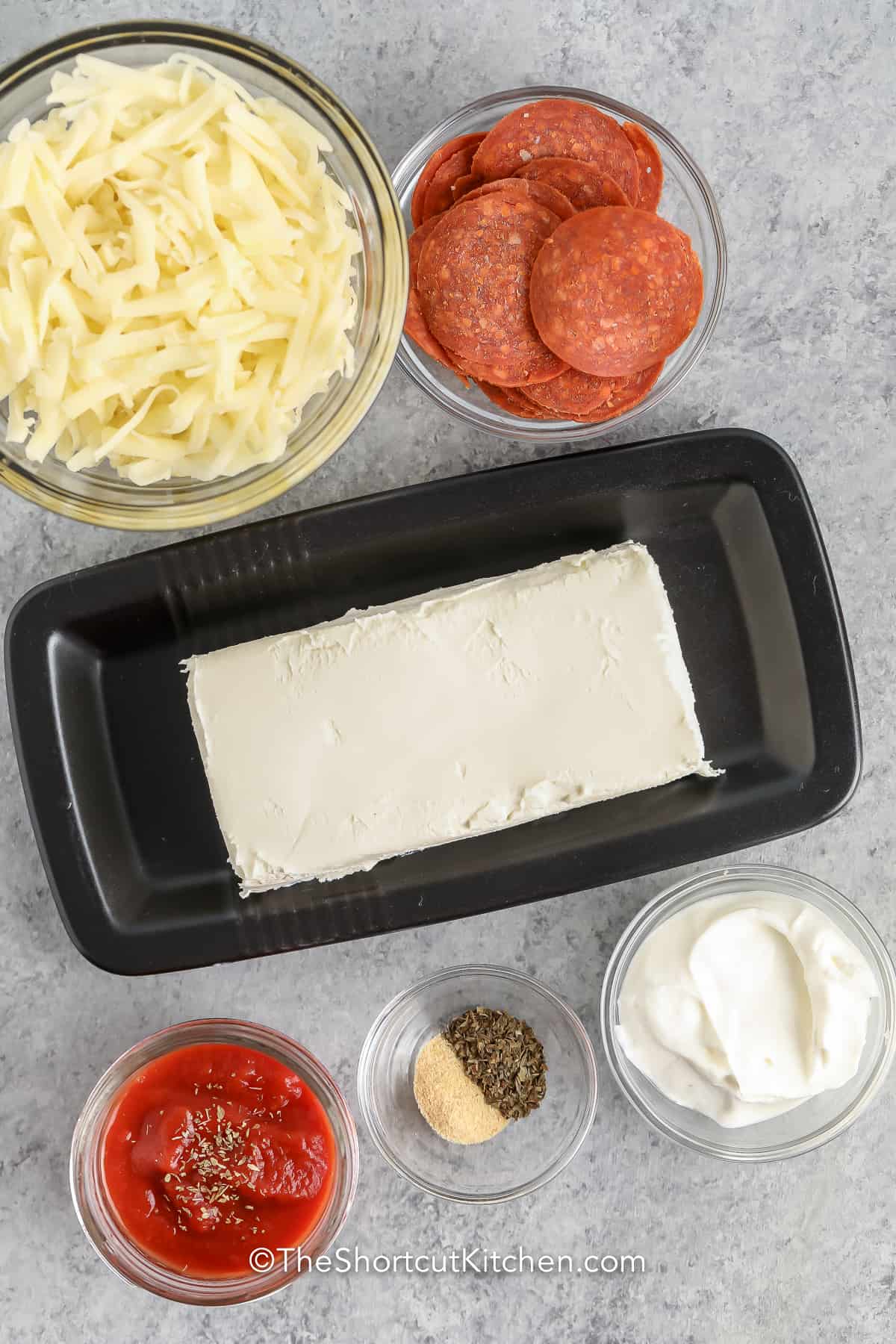 Cheesy Pizza Dip Ingredients on a counter