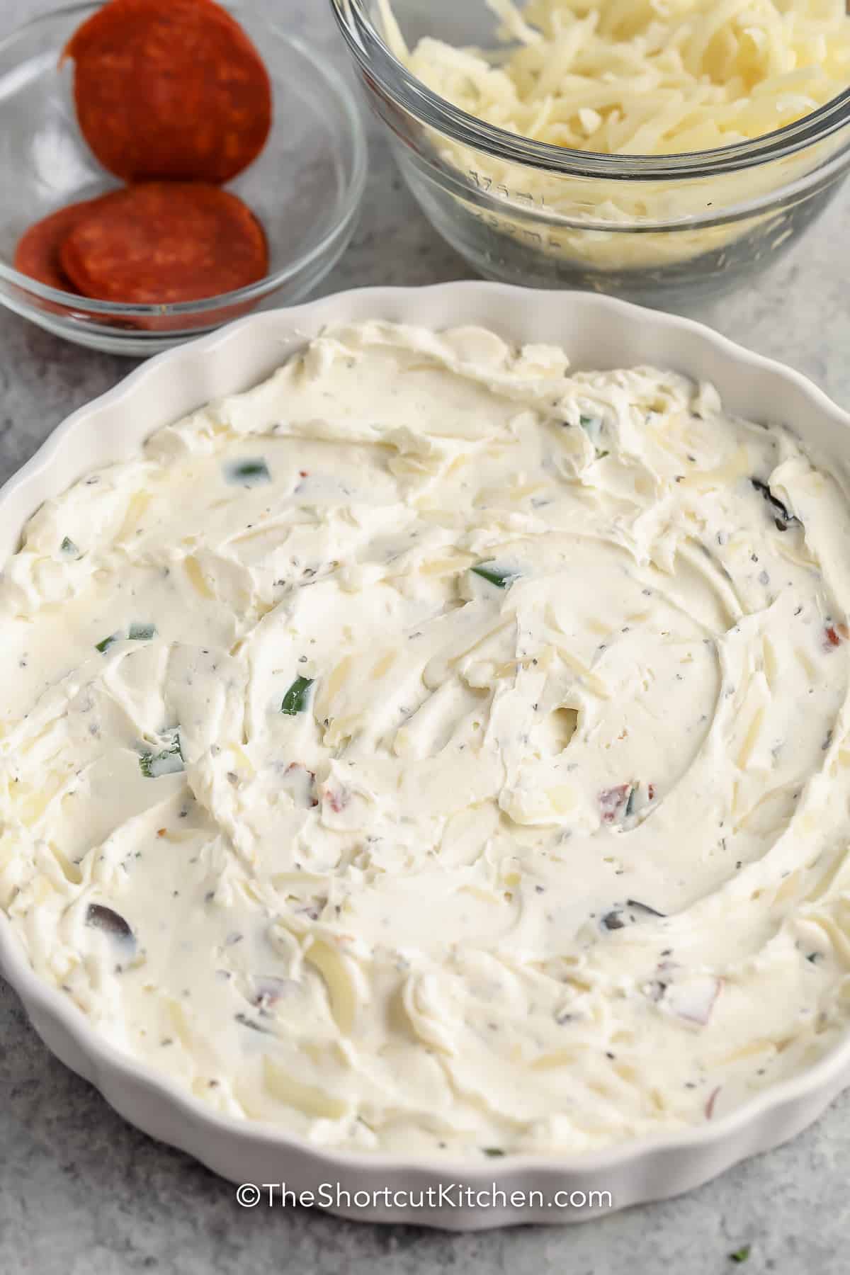 Cream cheese mixture spread in the bottom of a dish