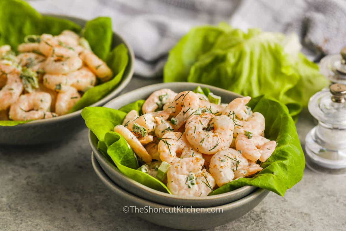 Shrimp salad served on a bed of lettuce in a bowl