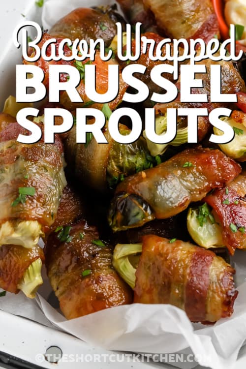bacon wrapped brussels sprouts in a tray with text