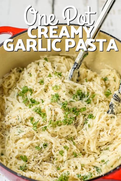 Creamy Garlic Pasta prepped in a pot with a title