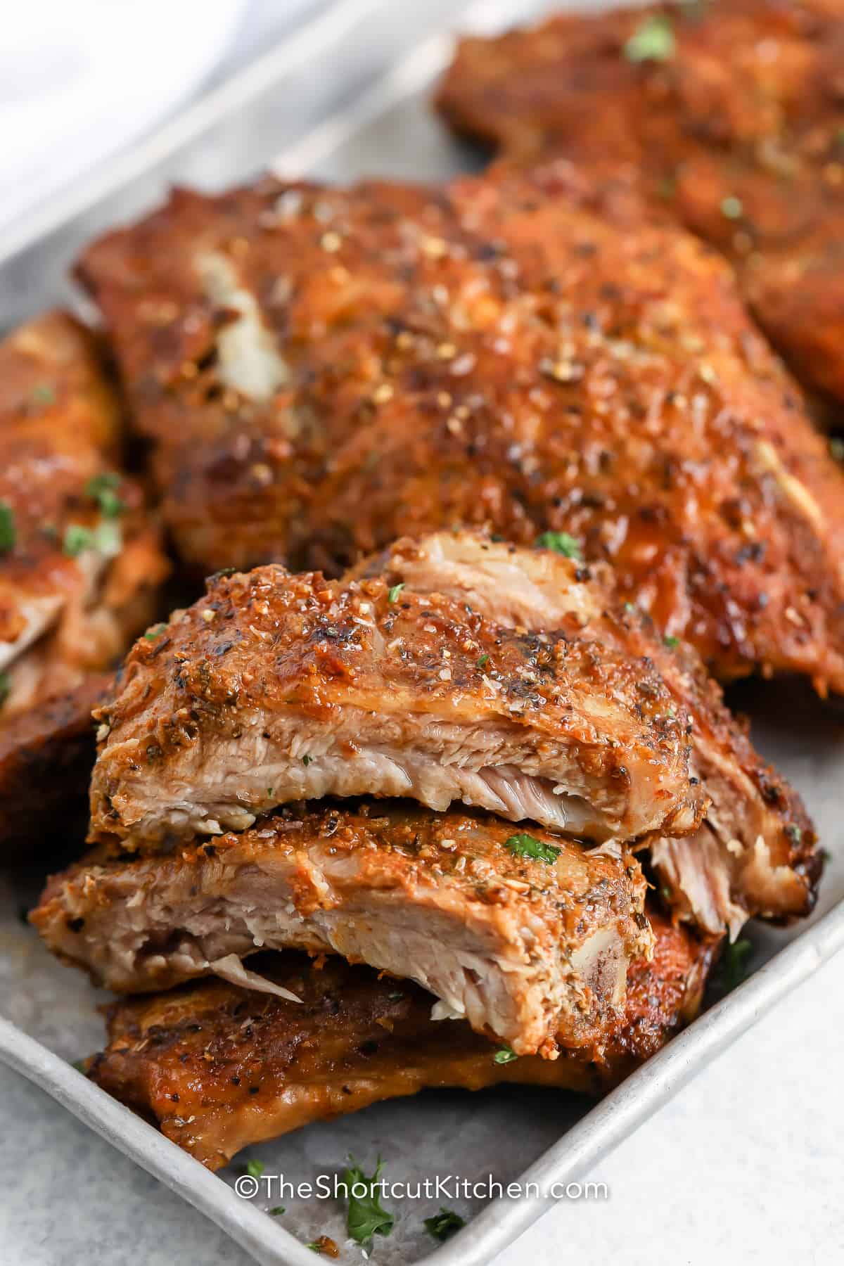 sliced oven baked ribs on a tray