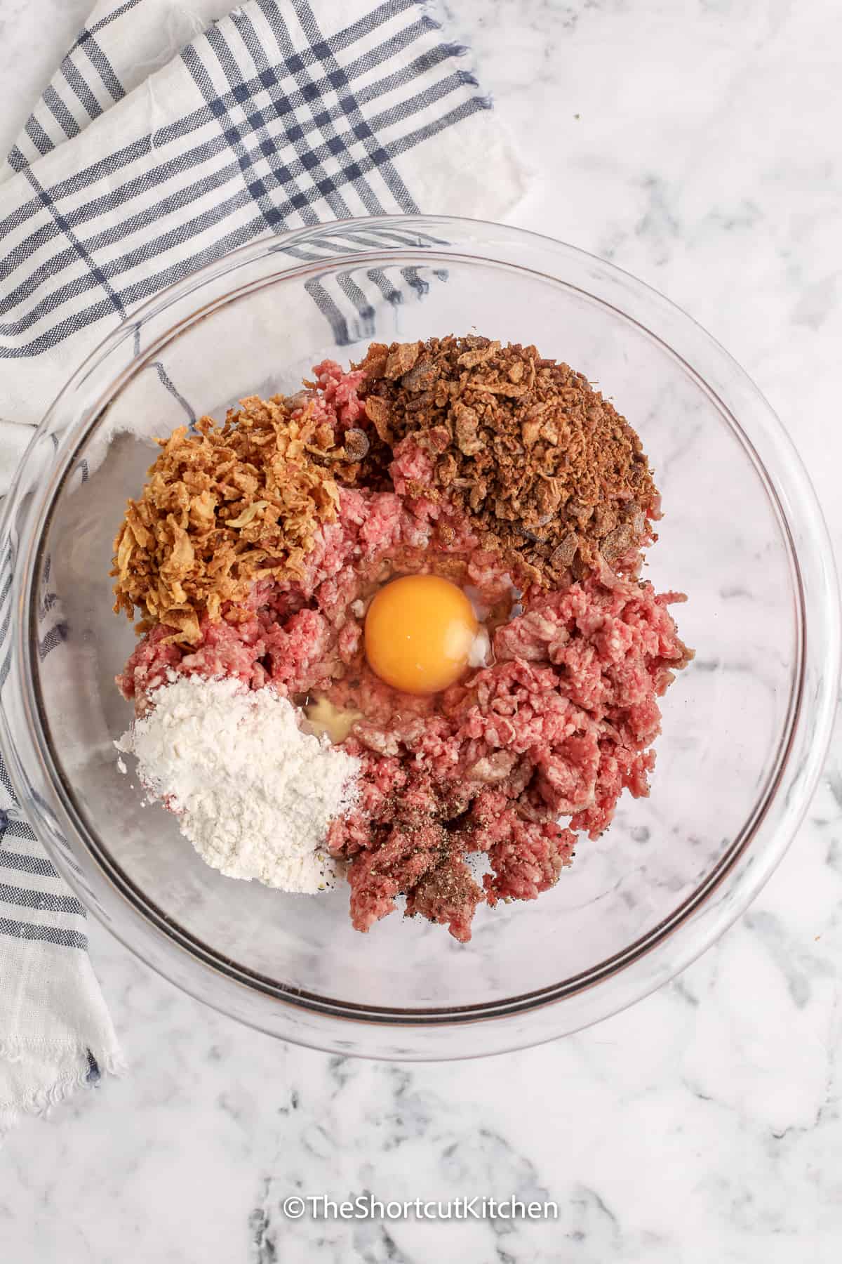 ingredients for bacon cheeseburger meatballs in a bowl