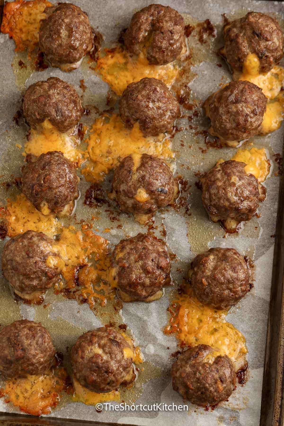 cooked meatballs on a baking tray