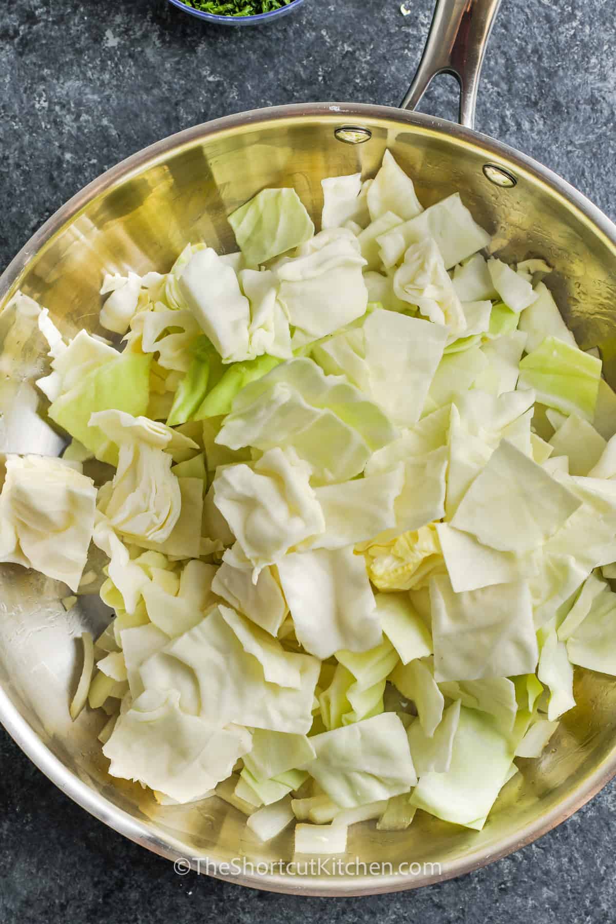 cooking cabbage to make Fried Cabbage and Sausage