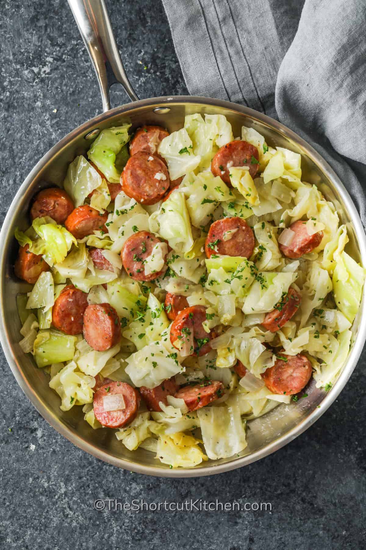 fried cabbage and sausage in a skillet