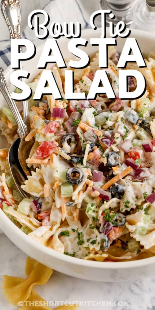 bow tie pasta salad in a bowl with text