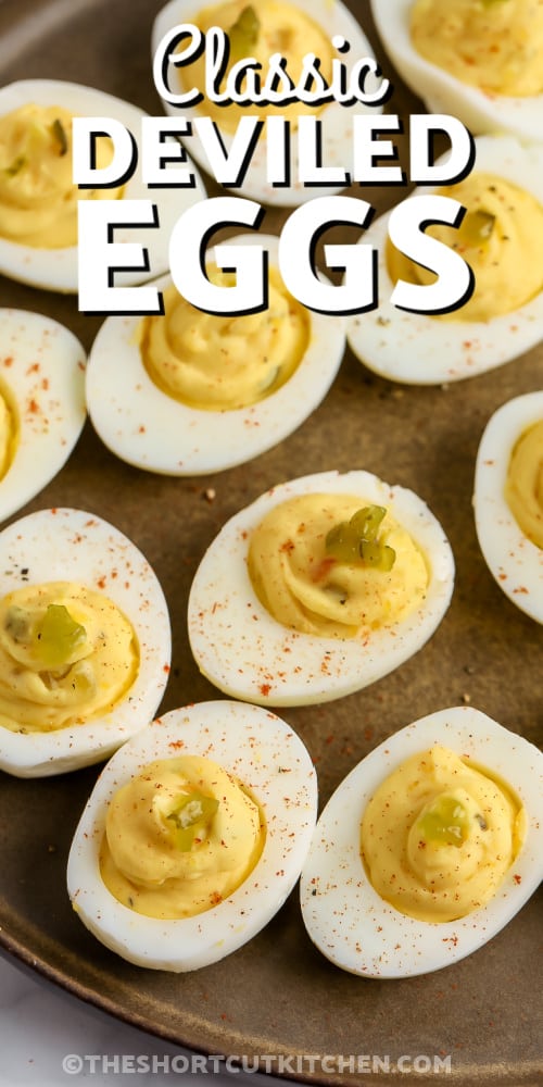 deviled eggs on a tray with text
