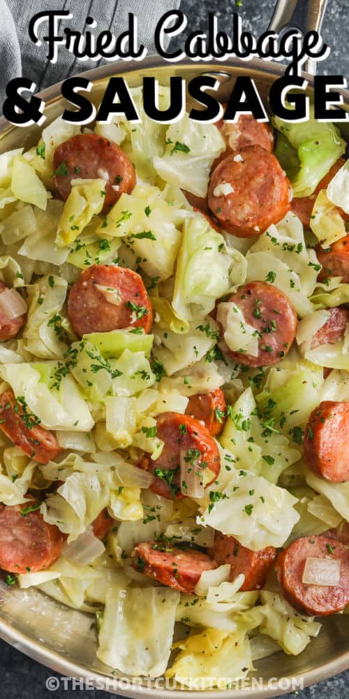 close up of Fried Cabbage and Sausage in the pan with a title