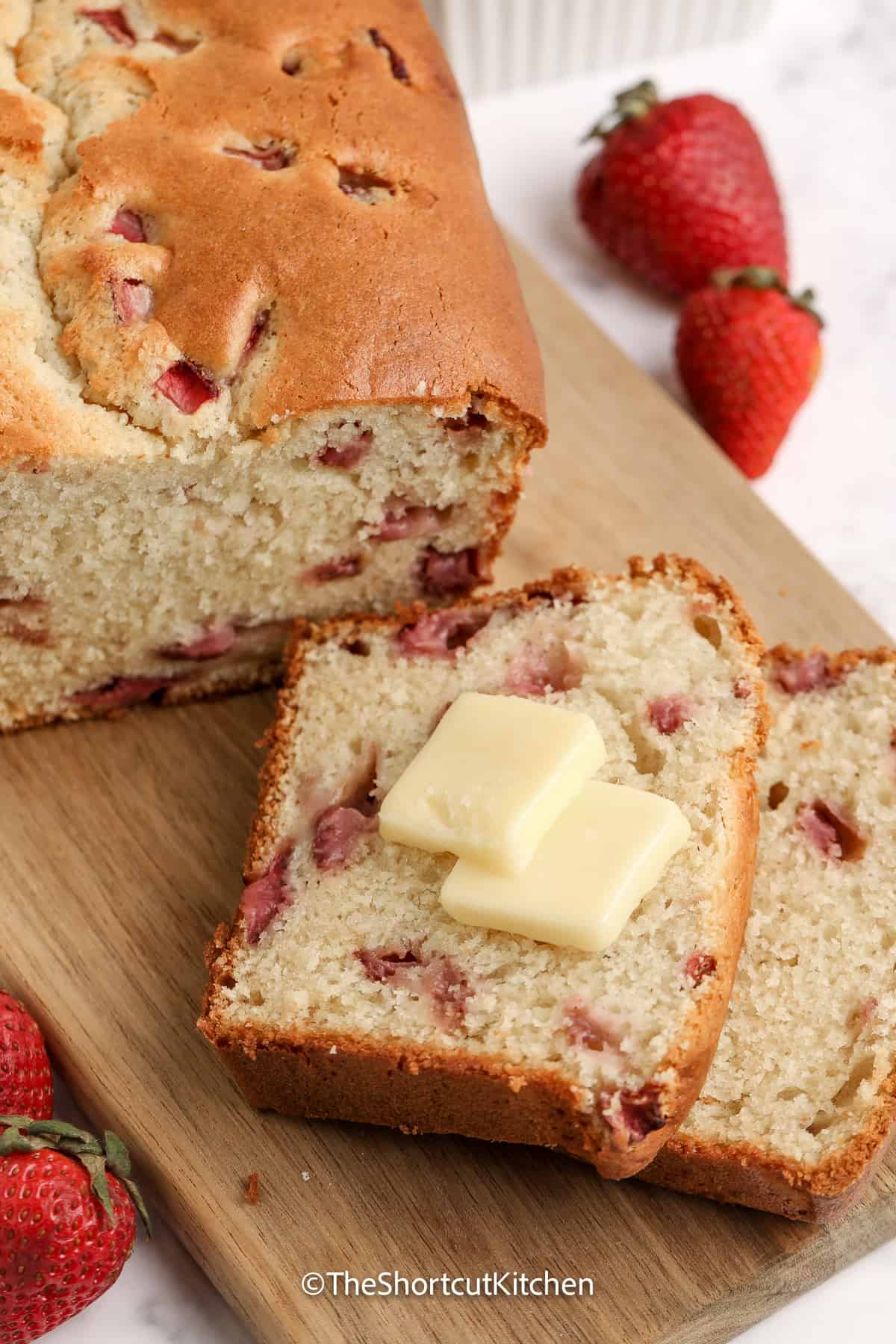 sliced strawberry cream cheese cake with butter