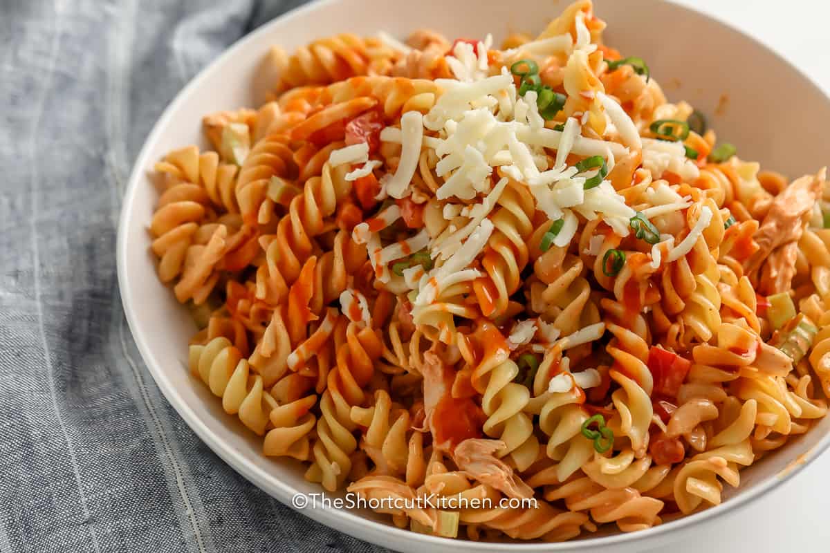 Buffalo Chicken Pasta Salad in a white serving bowl