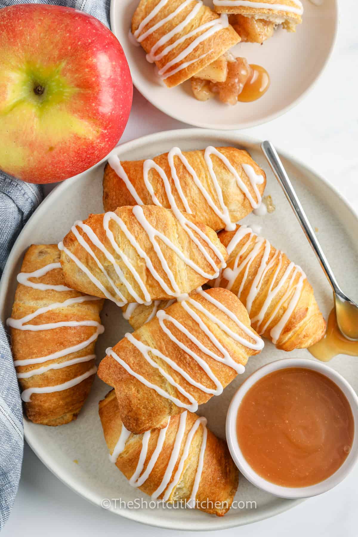 Easy Apple Turnovers Recipe on a plate with icing