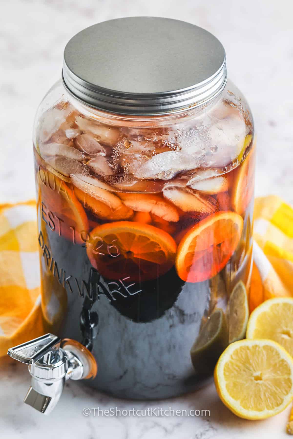 Easy Sweet Tea Recipe in the pitcher with lemons