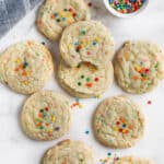 Funfetti Cake Mix Cookies on a table top with sprinkles