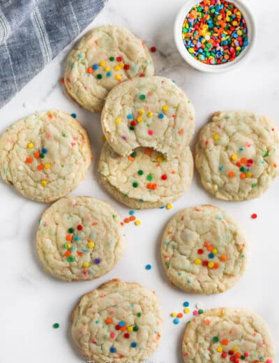 Funfetti Cake Mix Cookies on a table top with sprinkles