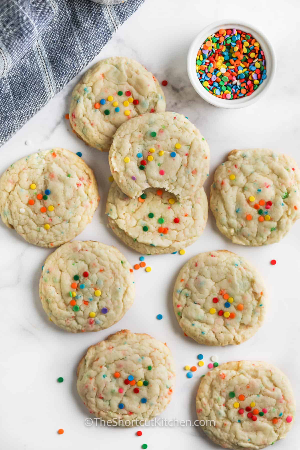 Funfetti Cake Mix Cookies on a table top with sprinkles