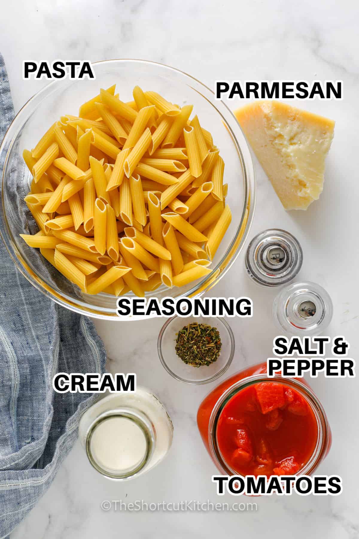 ingredients to make One Pot Creamy Tomato Pasta with labels
