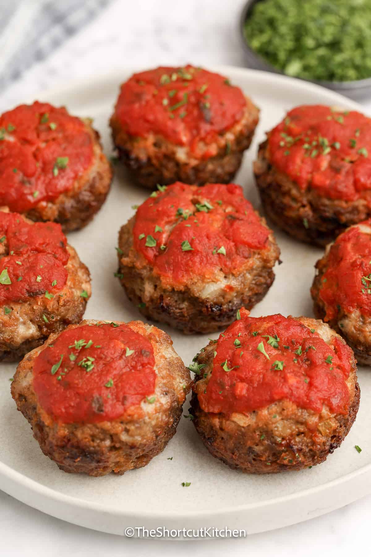 mozzarella stuffed mini meatloaf arranged on a plate