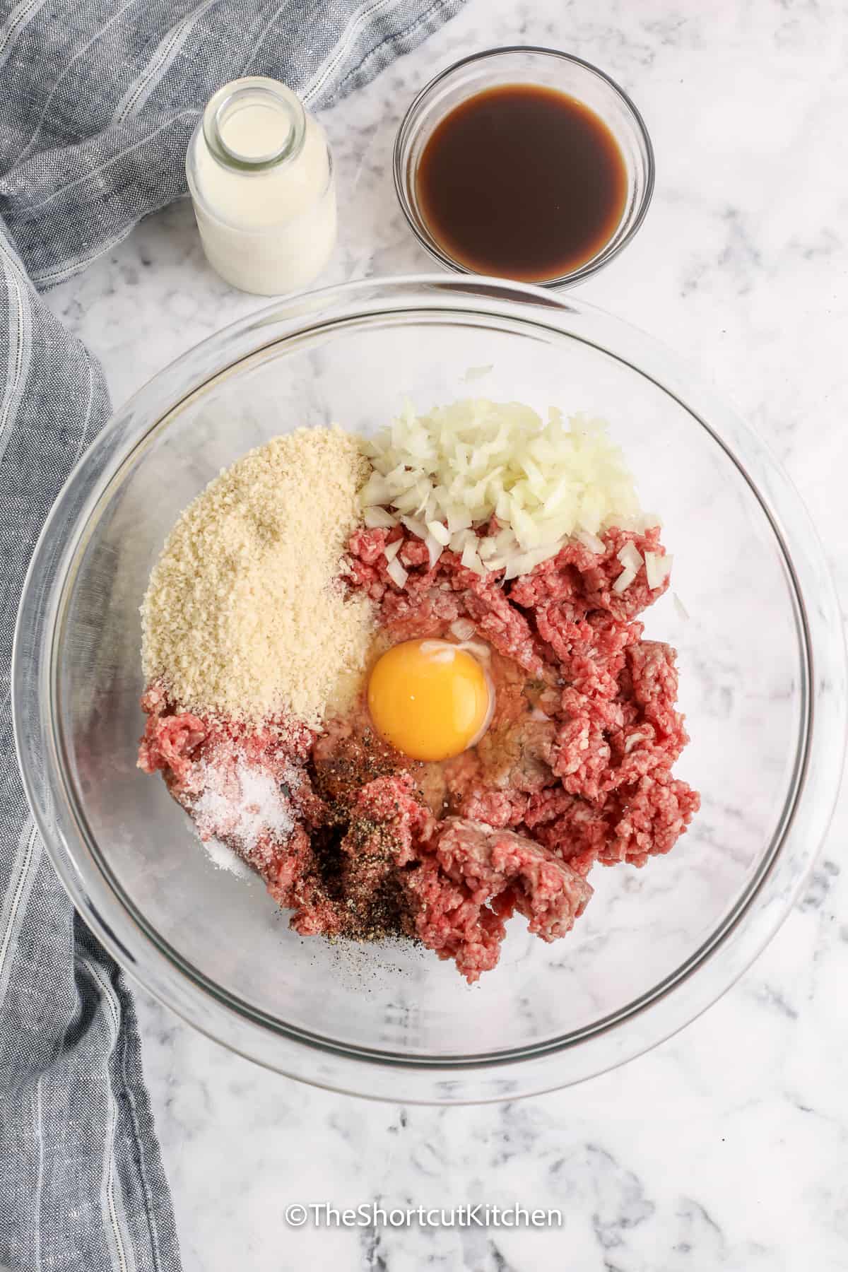 ingredients for mozzarella stuffed mini meatloaf in a mixing bowl