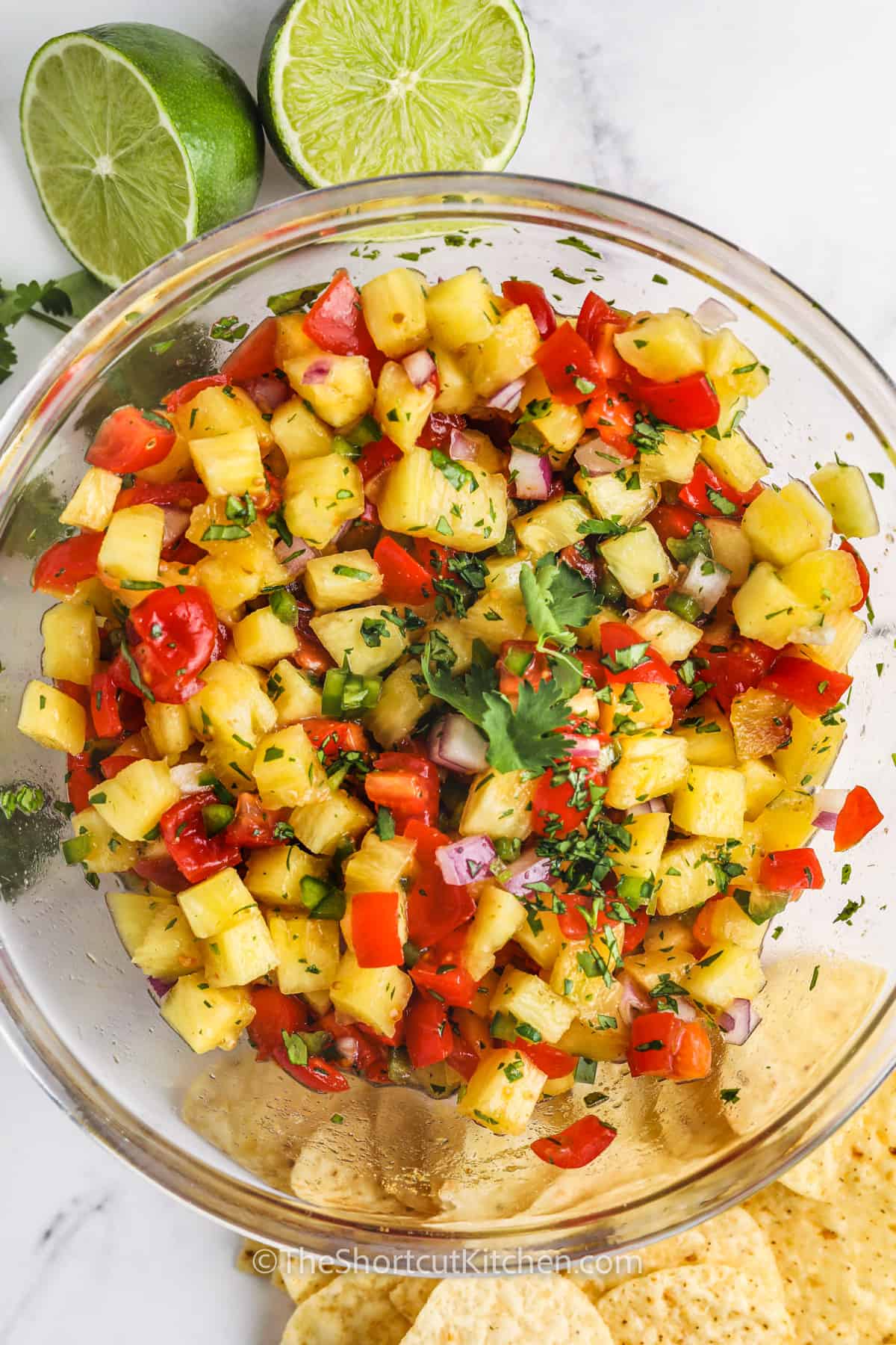 mixed Pineapple Salsa ingredients in a glass bowl