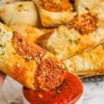 dipping Pizza Dippers in marinara sauce