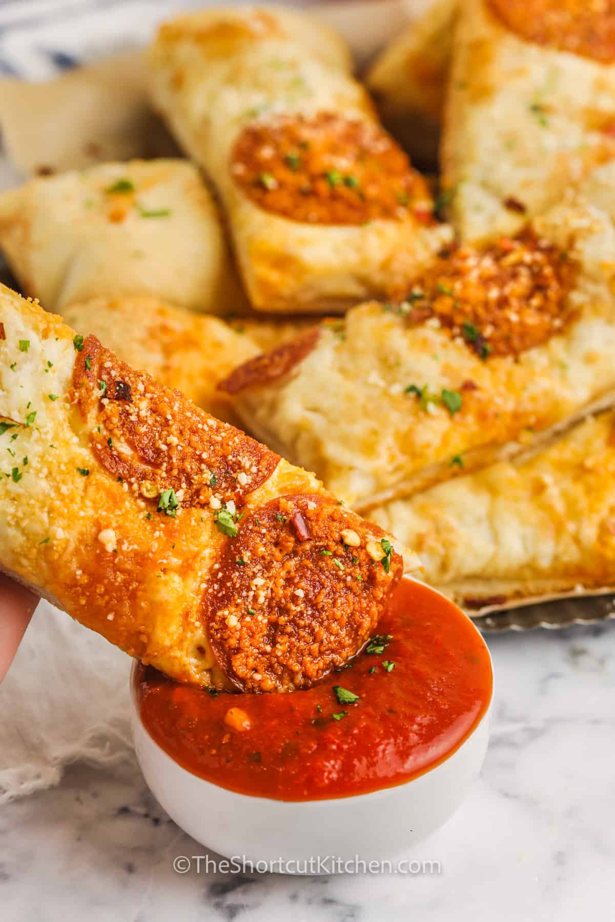 dipping Pizza Dippers in marinara sauce