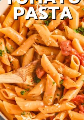 close up of cooked One Pot Creamy Tomato Pasta in the pot with a title