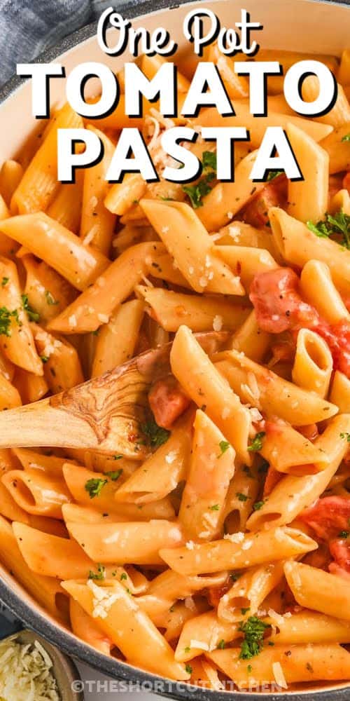 close up of cooked One Pot Creamy Tomato Pasta in the pot with a title