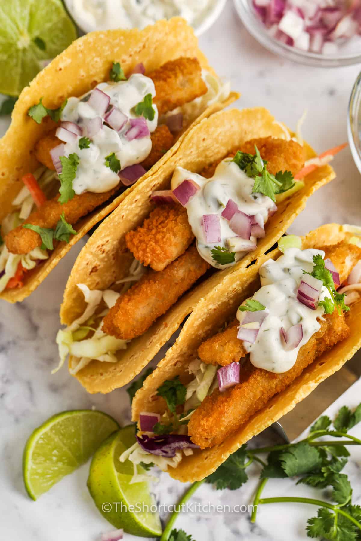 cooked Fish Stick Tacos with dressing