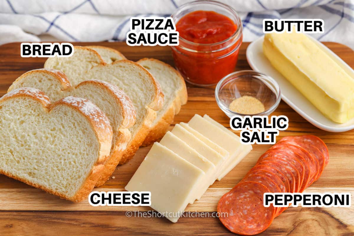 bread , pizza sauce , cheese , pepperoni and ingredients to make Grilled Pizza Sandwich with labels