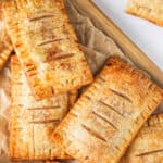 cooked Apple Hand Pies on a wooden board