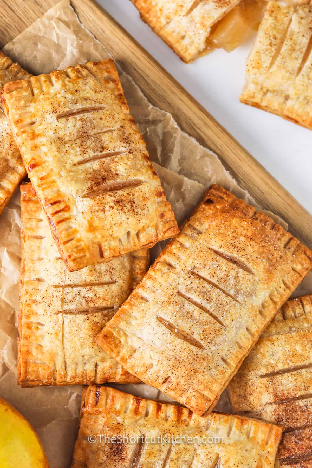 cooked Apple Hand Pies on a wooden board