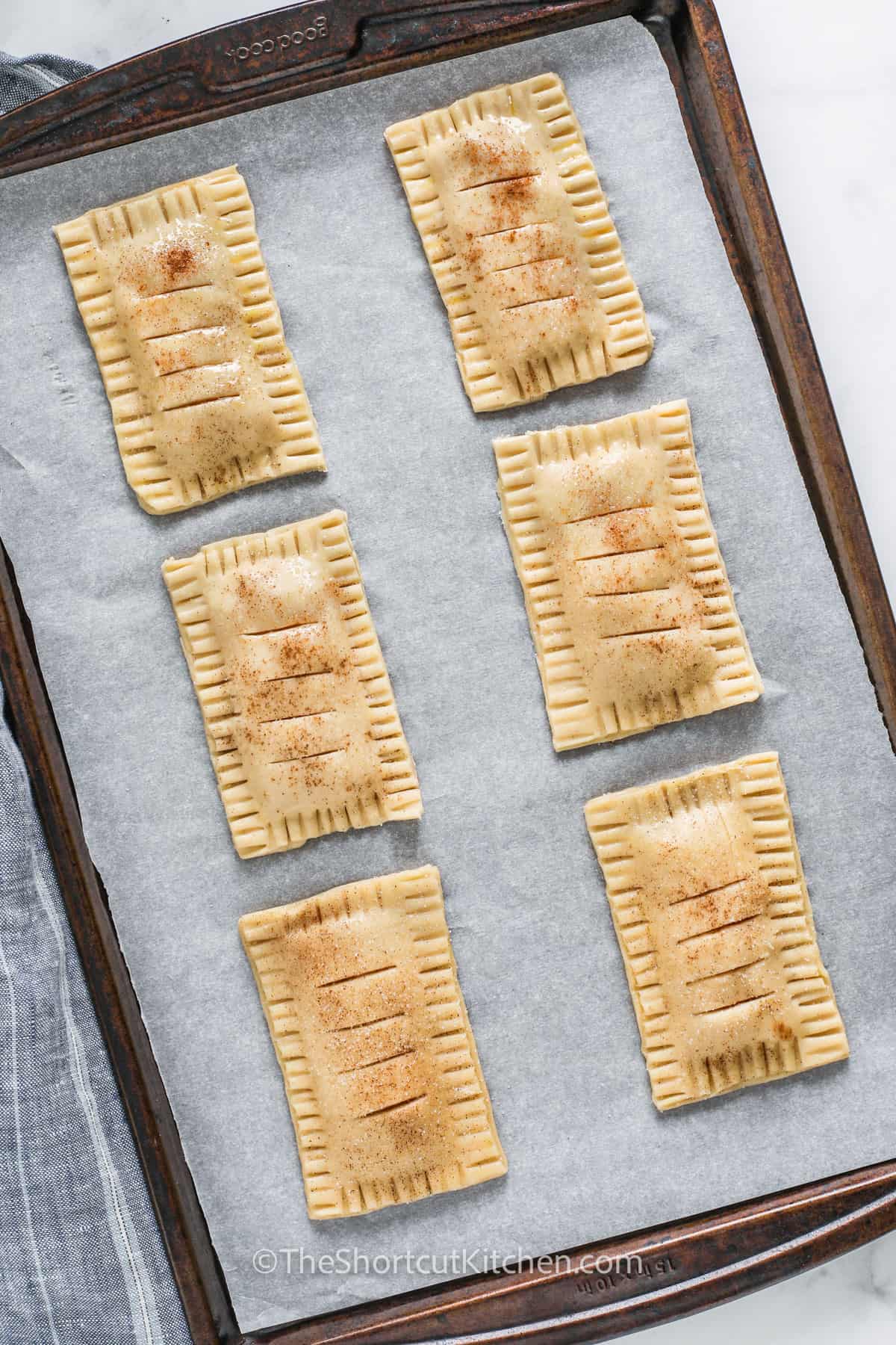 Apple Hand Pies on a sheet pan before cooking