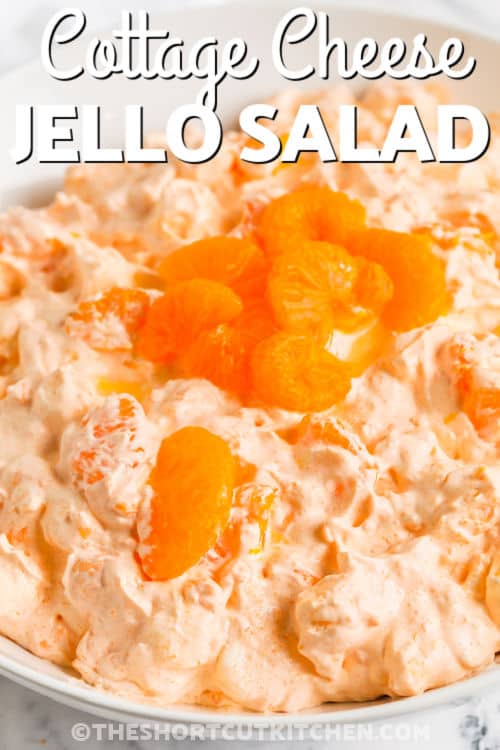 Cottage Cheese Orange Jello Salad in a bowl with writing