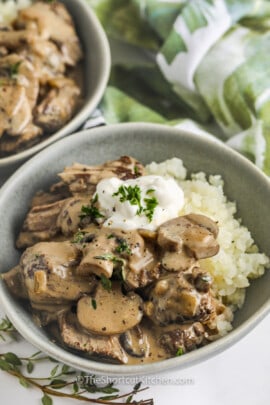 Beef Stroganoff Recipe in a bowl with mashed potatoes