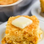 slice of Cornbread Casserole with butter on a plate