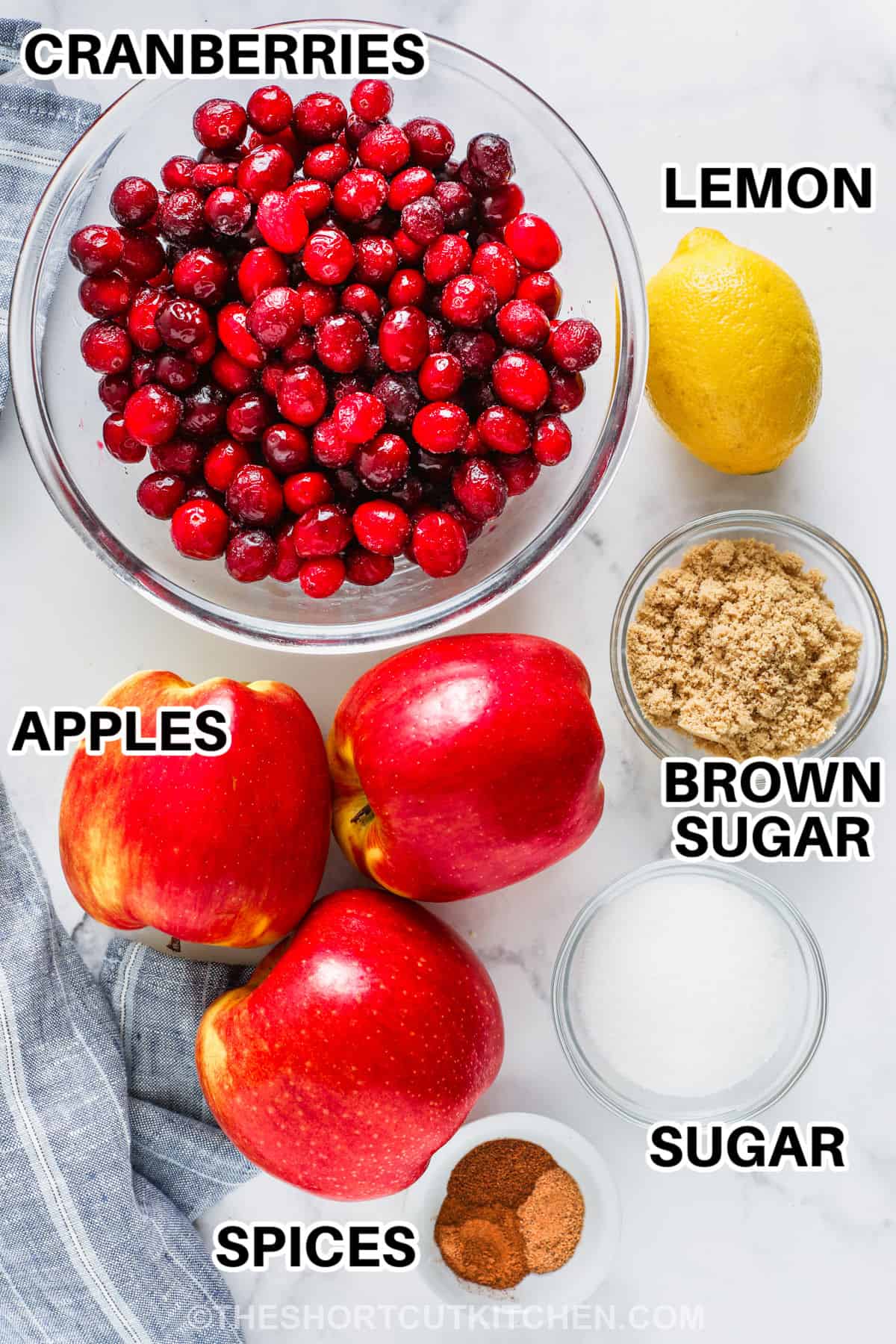 cranberries , apples , lemon , sugar and spices to make Fresh Cranberry Apple Sauce with labels
