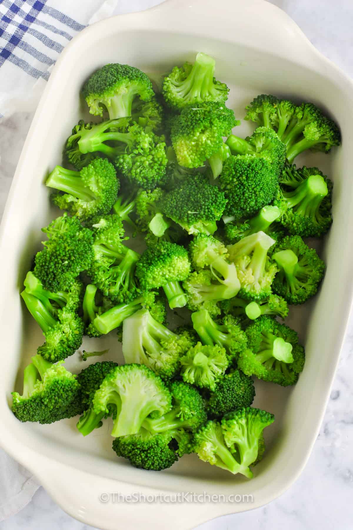broccoli in a dish to make Baked Broccoli and Cheese Casserole