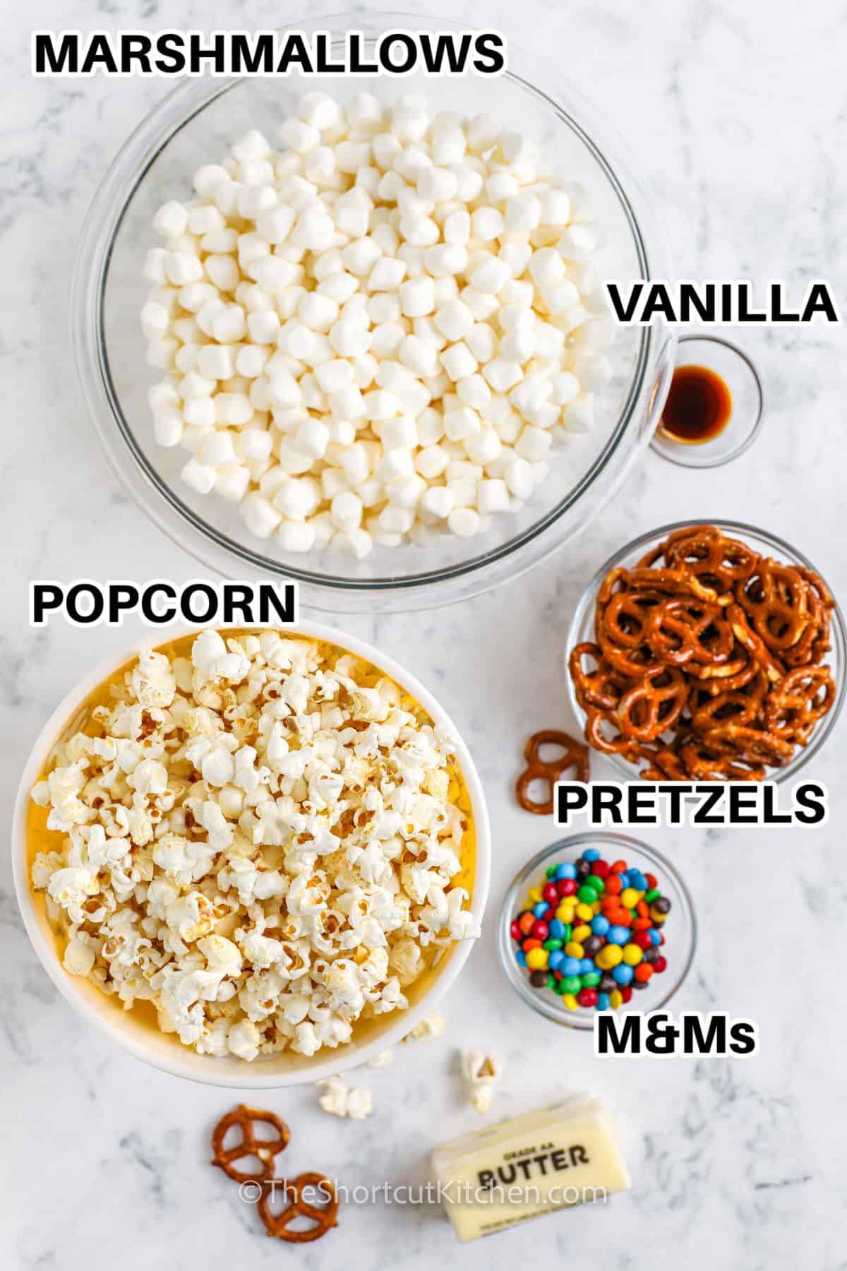 marshmallows , vanilla , pretzels , popcorn , m&ms and butter with labels to make Popcorn Bars
