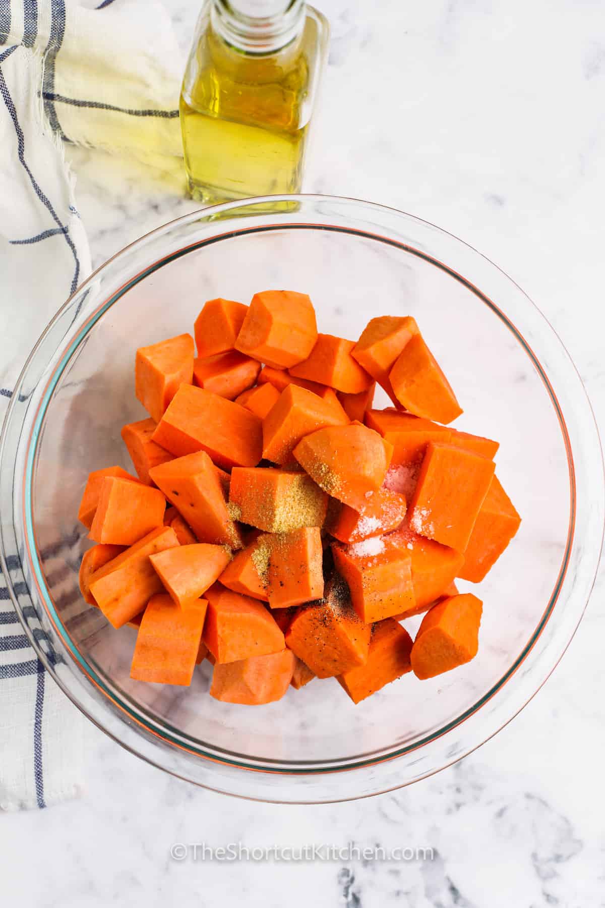 adding ingredients together to make Oven Roasted Sweet Potatoes