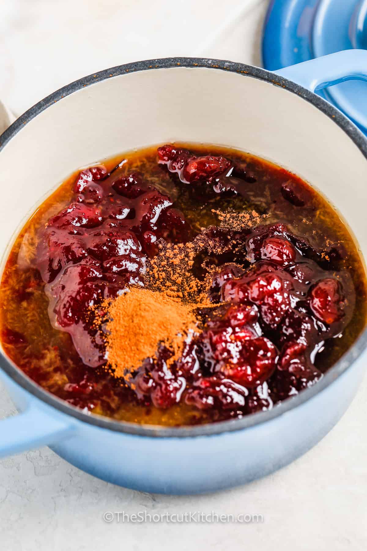 adding ingredients together to make Better Canned Cranberry Sauce