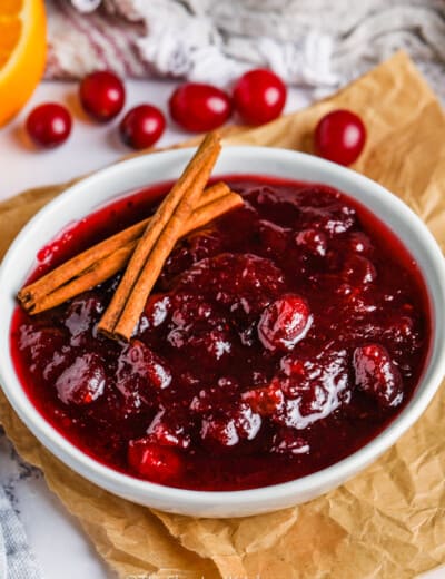 bowl of Better Canned Cranberry Sauce with cinnamon sticks