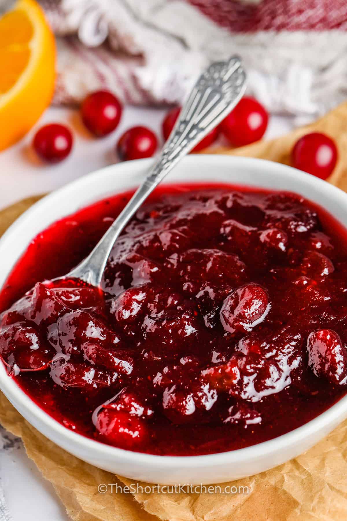 bowl of Better Canned Cranberry Sauce with a spoon
