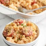 creamy sausage mac and cheese topped with parsley