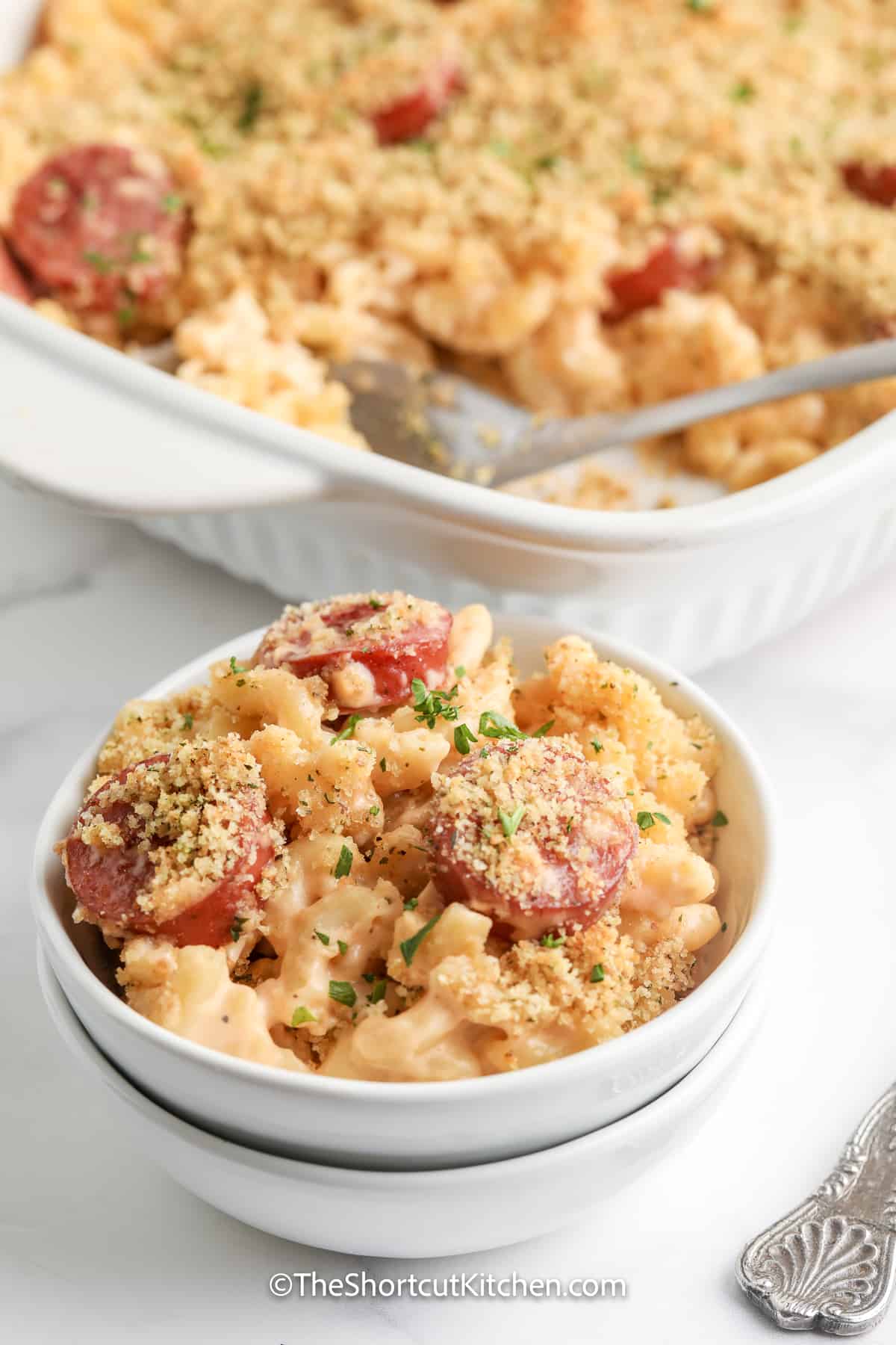 creamy sausage mac and cheese topped with parsley