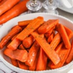 glazed Crockpot Carrots with crock pot in the back