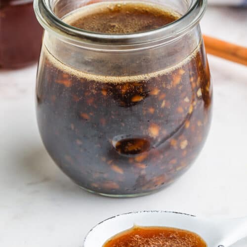 Homemade Honey Garlic Sauce in a jar and on a spoon