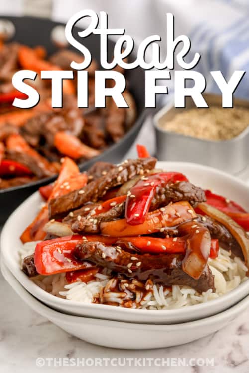 steak stir fry over rice with text
