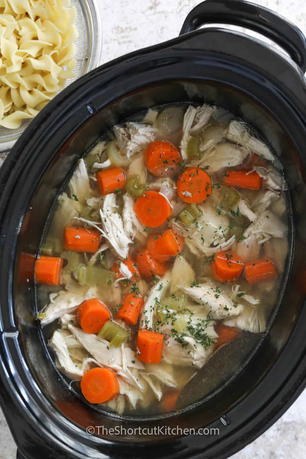cooked Crockpot Chicken Noodle Soup in the pot