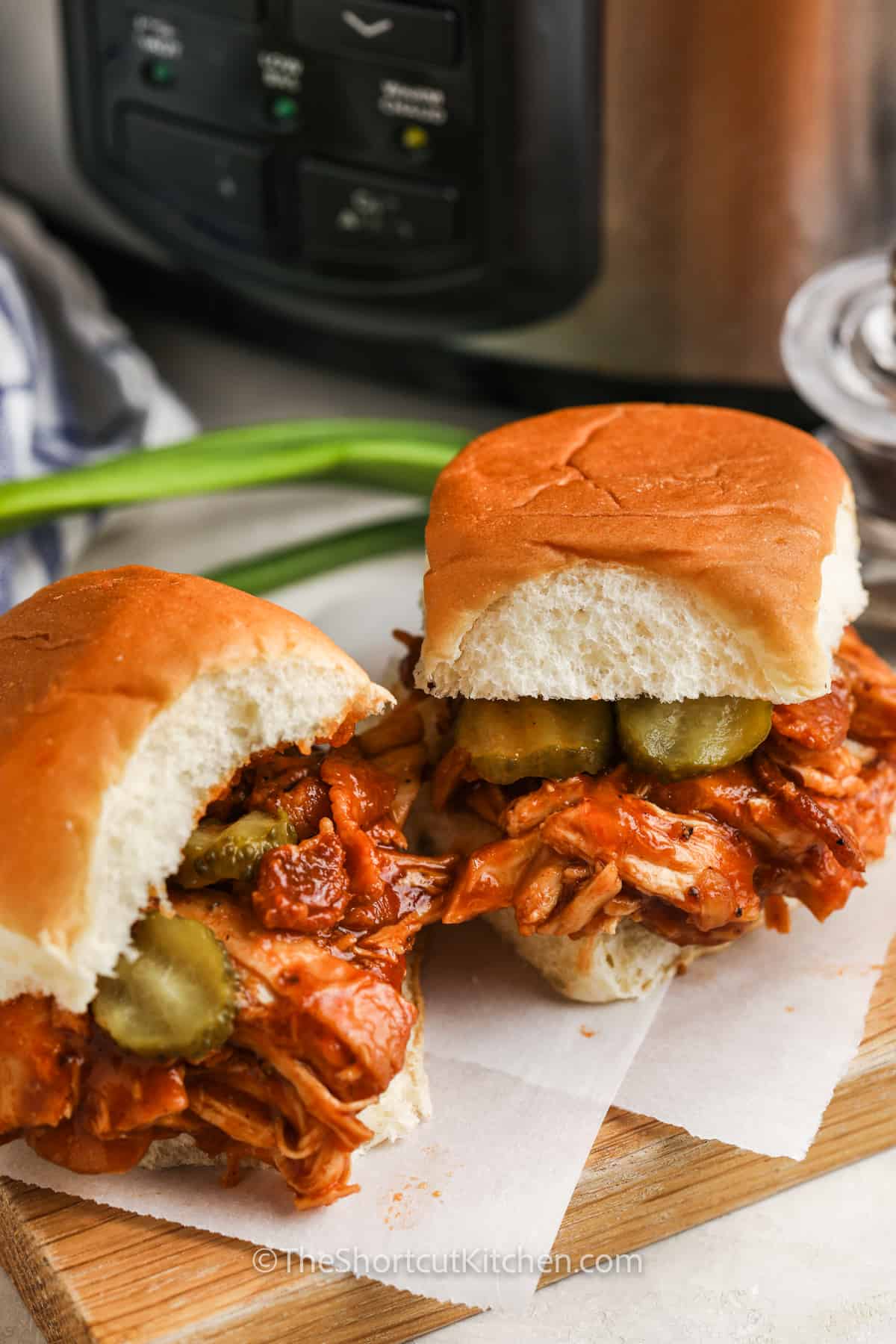BBQ Bacon Chicken Sliders with crockpot in the background